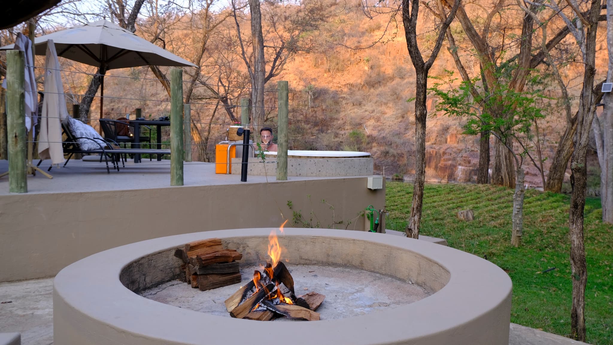 Chalet fire pit with bushveld backdrop