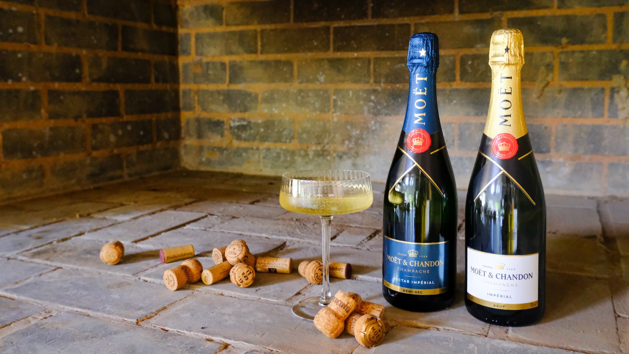 Moët & Chandon champagne with coupe glass and corks