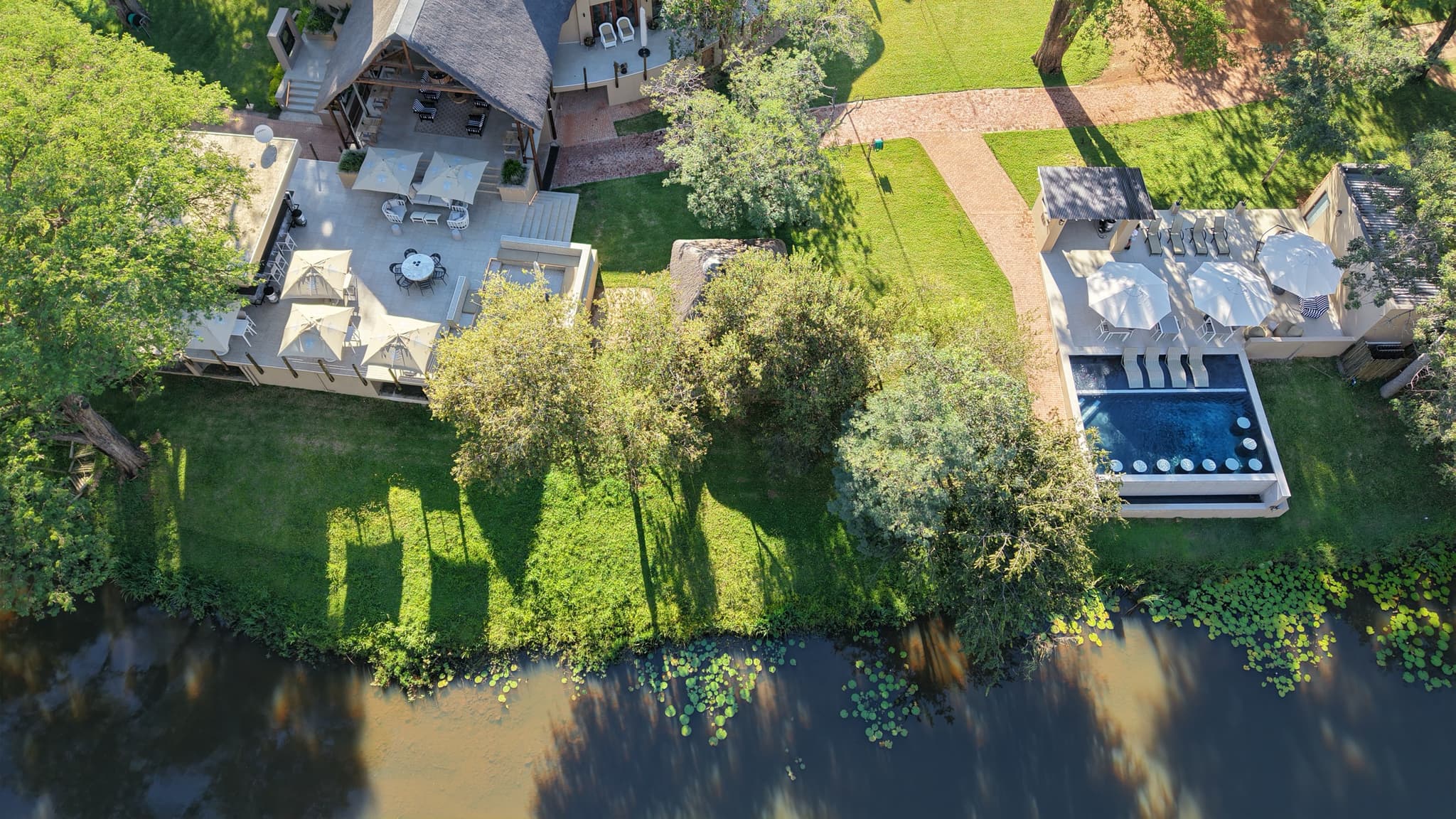 Bird's eye view of the lodge, pool, and river