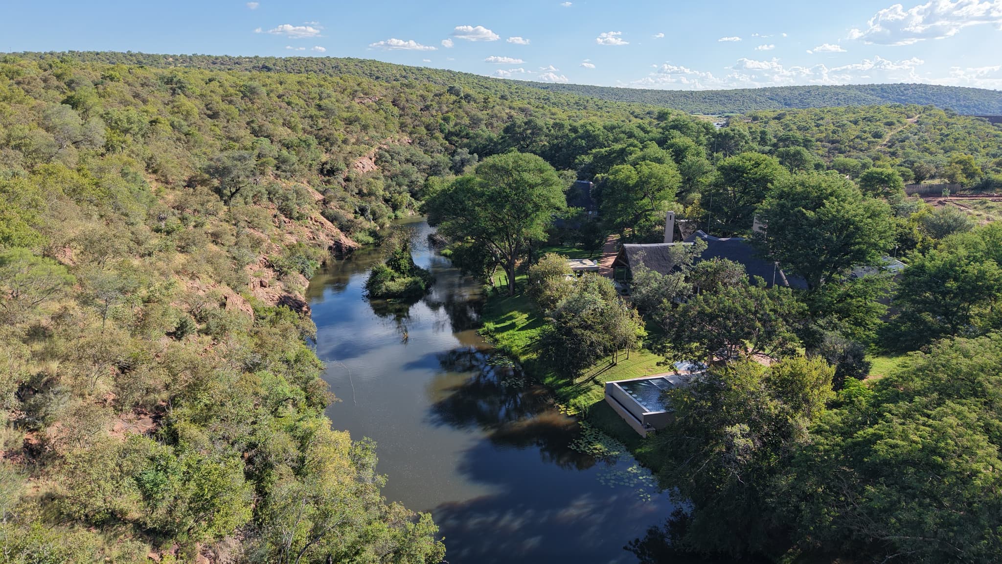 Aerial view of Mologa River Lodge along the river